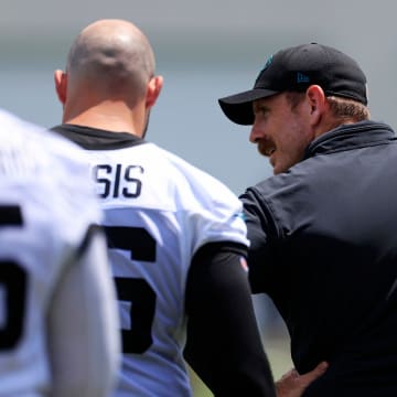 Jacksonville Jaguars defensive coordinator Ryan Nielsen talks with defensive end Adam Gotsis (96) during an organized team activity Tuesday, May 28, 2024 at EverBank Stadium’s Miller Electric Center in Jacksonville, Fla.