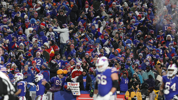 Bills fans cheer and throw snow in the air after QB Josh Allen scores a touchdown during the first half of the Bills divisional game against Kansas City Chiefs at Highmark Stadium in Orchard Park on Jan. 21, 2024.