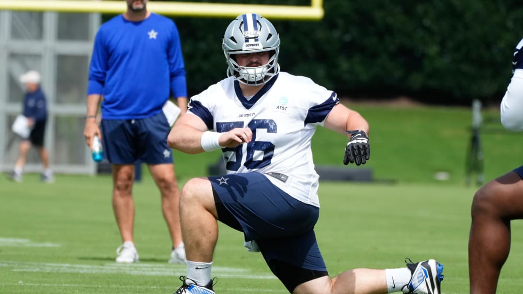 Jun 5, 2024; Frisco, TX, USA;  Dallas Cowboys center Cooper Beebe (56) goes through a drill during practice at the Ford Center at the Star Training Facility in Frisco, Texas. Mandatory Credit: Chris Jones-USA TODAY Sports