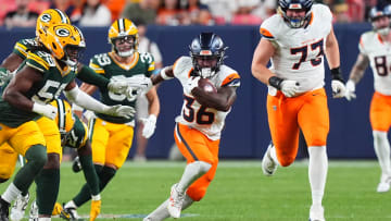 Aug 18, 2024; Denver, Colorado, USA; Denver Broncos running back Tyler Badie (36) carries the ball in the third quarter at Empower Field at Mile High. Mandatory Credit: Ron Chenoy-USA TODAY Sports