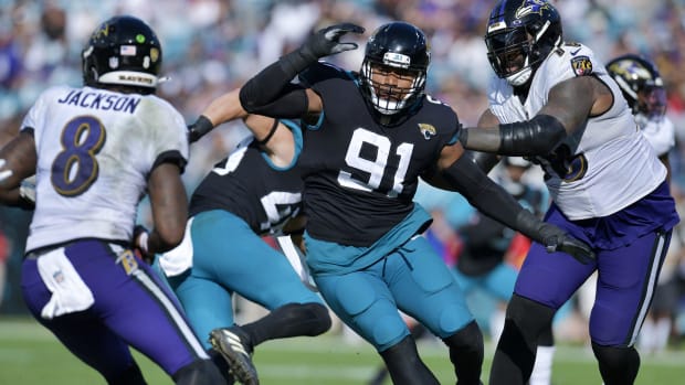 Jacksonville Jaguars defensive end Dawuane Smoot (91) goes after Baltimore Ravens quarterback Lamar Jackson (8) during early second quarter action at TIAA Bank Field in Jacksonville, FL Sunday, November 27, 2022.