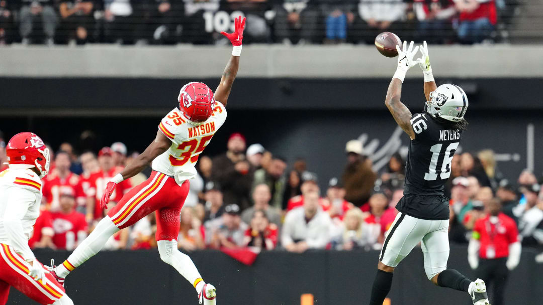 Nov 26, 2023; Paradise, Nevada, USA; Las Vegas Raiders wide receiver Jakobi Meyers (16) makes a catch behind Kansas City Chiefs cornerback Jaylen Watson (35) during the first quarter at Allegiant Stadium. Mandatory Credit: Stephen R. Sylvanie-USA TODAY Sports