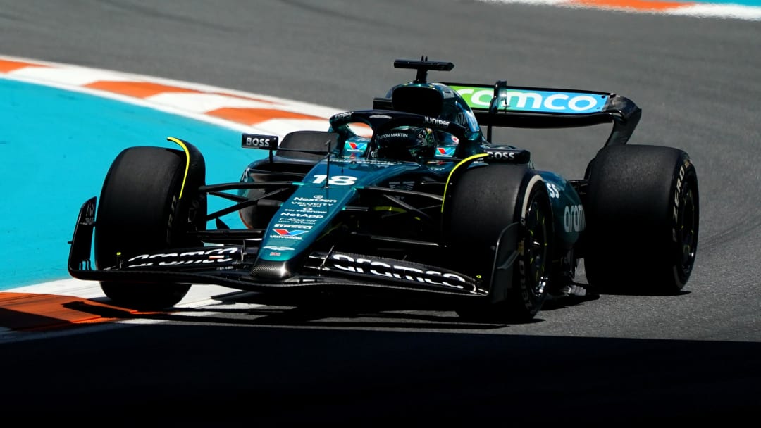 May 3, 2024; Miami Gardens, Florida, USA; Aston Martin driver Lance Stroll (18) races into turn three during F1 practice at Miami International Autodrome. Mandatory Credit: John David Mercer-USA TODAY Sports