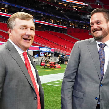 Sep 3, 2022; Atlanta, Georgia, USA;  Georgia Bulldogs head coach Kirby Smart greets Oregon Ducks head coach Dan Lanning midfield before the Chick-fil-A kickoff game at Mercedes-Benz Stadium. Mandatory Credit: John David Mercer-USA TODAY Sports