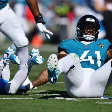 Jacksonville Jaguars linebacker Josh Allen (41) lets out a celebratory yell after his late second quarter sack on Carolina Panthers quarterback Bryce Young (9). The Jacksonville Jaguars hosted the Carolina Panthers at EverBank Stadium in Jacksonville, FL Sunday, December 31, 2023. The Jaguars went in at the half with a 9 to 0 lead. [Bob Self/Florida Times-Union]