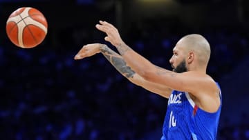 Jul 30, 2024; Villeneuve-d'Ascq, France; France shooting guard Evan Fournier (10) passes the ball against Japan point guard Yuki Togashi (2) in men’s basketball group B play during the Paris 2024 Olympic Summer Games at Stade Pierre-Mauroy. Mandatory Credit: John David Mercer-USA TODAY Sports