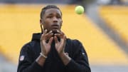 Dec 23, 2023; Pittsburgh, Pennsylvania, USA;  Cincinnati Bengals wide receiver Tee Higgins (5) warms up with tennis balls before the game against the Pittsburgh Steelers at Acrisure Stadium. Mandatory Credit: Charles LeClaire-USA TODAY Sports