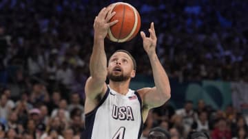 Jul 31, 2024; Villeneuve-d'Ascq, France; United States shooting guard Stephen Curry (4) drives against South Sudan point guard Marial Shayok (11) in the fourth quarter during the Paris 2024 Olympic Summer Games at Stade Pierre-Mauroy. Mandatory Credit: John David Mercer-USA TODAY Sports