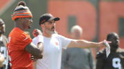 Browns quarterback Deshaun Watson talks with head coach Kevin Stefanski during a workout, Wednesday, June 8, 2022 in Berea.