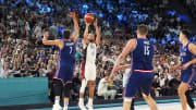 Aug 8, 2024; Paris, France; United States guard Stephen Curry (4) shoots the ball over Serbia guard Bogdan Bogdanovic (7) during the men's basketball semifinal game during the Paris 2024 Olympic Summer Games at Accor Arena. 