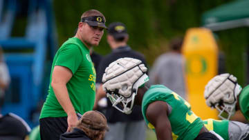 Oregon defensive coordinator Tosh Lupoi watches over practice with the Ducks Wednesday, Aug. 17, 2022, in Eugene, Oregon