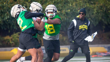 New co-defensive coordinator and safeties coach Chris Hampton, right, joins the first practice of spring for Oregon football as they prepare for the 2023 season.