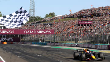 Race winner Max Verstappen of the Netherlands driving the (1) Oracle Red Bull Racing RB19 takes the chequered flag during the F1 Grand Prix of Hungary at Hungaroring on July 23, 2023 in Budapest, Hungary. (Photo by Peter Fox/Getty Images)