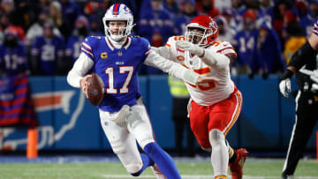 Buffalo Bills quarterback Josh Allen (17) has to scramble away from Kansas City Chiefs defensive tackle Chris Jones (95).