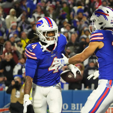 Dec 17, 2023; Orchard Park, NY; Buffalo Bills running back James Cook (4) celebrates a touchdown with Buffalo Bills wide receiver Khalil Shakir (10) in the first half against the Dallas Cowboys at Highmark Stadium.