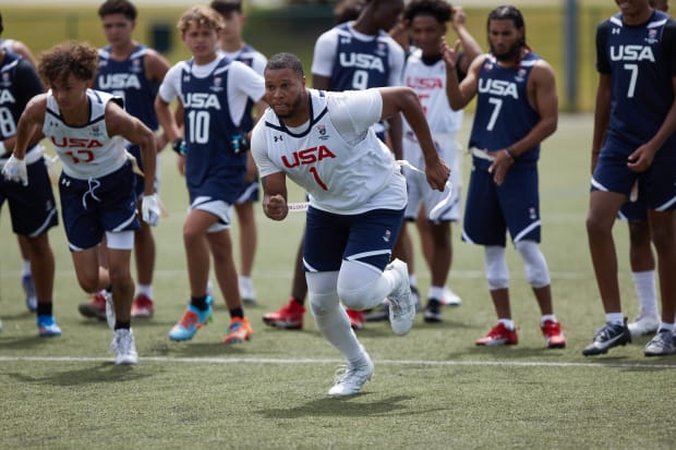 Football players train in Under Armour gear.