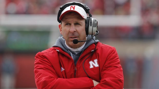 Nebraska Cornhuskers head coach Bo Pelini walks the sideline against Minnesota Golden Gophers at Memorial Stadium.