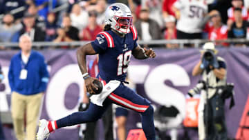 New England Patriots quarterback Joe Milton runs against the Carolina Panthers at Gillette Stadium.