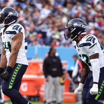 Dec 24, 2023; Nashville, Tennessee, USA; Seattle Seahawks linebacker Bobby Wagner (54) and linebacker Darrell Taylor (52) celebrate after a sack during the second half against the Tennessee Titans at Nissan Stadium. Mandatory Credit: Christopher Hanewinckel-USA TODAY Sports