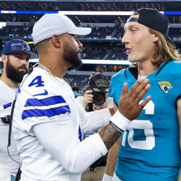 Aug 12, 2023; Arlington, Texas, USA;  Dallas Cowboys quarterback Dak Prescott (4) greets Jacksonville Jaguars quarterback Trevor Lawrence (16) after the game at AT&T Stadium. Mandatory Credit: Kevin Jairaj-USA TODAY Sports