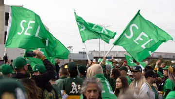 Mar 28, 2024; Oakland, California, USA; Oakland Athletics fans wave “Sell” flags to protest ownership plans to move to the franchise to Las Vegas, before a game between the Athletics and Cleveland Guardians at Oakland-Alameda County Coliseum. Mandatory Credit: D. Ross Cameron-USA TODAY Sports