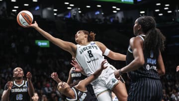 May 23, 2024; Brooklyn, New York, USA;  New York Liberty forward Nyara Sabally (8) drives past Chicago Sky guard Dana Evans (11) in the first quarter at Barclays Center. Mandatory Credit: Wendell Cruz-USA TODAY Sports