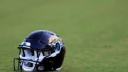 A Jacksonville Jaguars helmet lies on the turf Wednesday, July 26, 2023 at Miller Electric Center at EverBank Stadium in Jacksonville, Fla. Today marked the first day of training camp for the Jacksonville Jaguars.