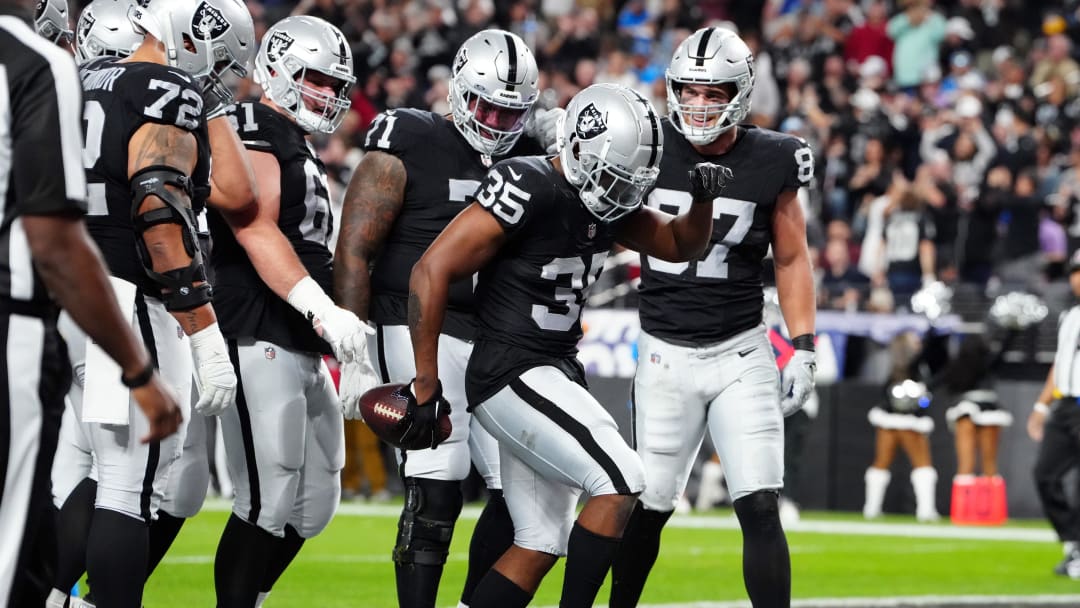 Dec 14, 2023; Paradise, Nevada, USA; Las Vegas Raiders running back Zamir White (35) celebrates after scoring a touchdown against the Los Angeles Chargers in the first quarter at Allegiant Stadium. Mandatory Credit: Stephen R. Sylvanie-USA TODAY Sports