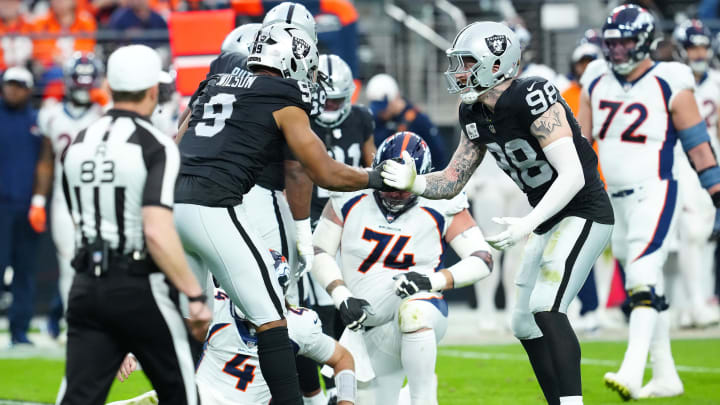 Jan 7, 2024; Paradise, Nevada, USA; Las Vegas Raiders defensive end Tyree Wilson (9) celebrates with Las Vegas Raiders defensive end Maxx Crosby (98) after sacking Denver Broncos quarterback Jarrett Stidham (4) during the second quarter at Allegiant Stadium. Mandatory Credit: Stephen R. Sylvanie-USA TODAY Sports