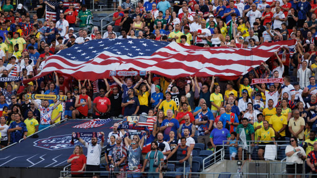 Jun 12, 2024; Orlando, Florida, USA;  fans watch a match between the United States and Brazil during the Continental Clasico at Camping World Stadium. Mandatory Credit: Nathan Ray Seebeck-USA TODAY Sports