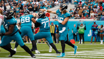 Nov 12, 2023; Jacksonville, Florida, USA; Jacksonville Jaguars quarterback Trevor Lawrence (16) throws a pass with offensive lineman Brandon Scherff (68), offensive tackle Anton Harrison (77), and offensive lineman Cam Robinson (74) block San Francisco 49ers defense during the third quarter at EverBank Stadium. Mandatory Credit: Morgan Tencza-USA TODAY Sports