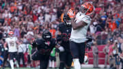 Oct 8, 2023; Glendale, Arizona, USA; Cincinnati Bengals wide receiver Ja'Marr Chase (1) catches a touchdown pass against Arizona Cardinals safety K'Von Wallace (22) and Arizona Cardinals cornerback Marco Wilson (20) during the second half at State Farm Stadium. Mandatory Credit: Joe Camporeale-USA TODAY Sports