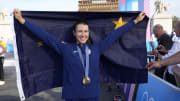 Aug 4, 2024; Paris, France; Gold medalist Kristen Faulkner (USA) celebrates after the women's cycling road race during the Paris 2024 Olympic Summer Games at Pont d'Iena. Mandatory Credit: Andrew P. Scott-USA TODAY Sports