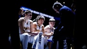 Denver Nuggets center Nikola Jokic (15) and forward Aaron Gordon (50) and guard Christian Braun (0) look on as head coach Michael Malone talks during a timeout in the first quarter against the Memphis Grizzlies at Ball Arena. 