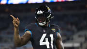 Jacksonville Jaguars linebacker Josh Allen (41) points to a familiar face before a regular season