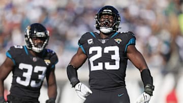 Jacksonville Jaguars linebacker Foyesade Oluokun (23) reacts to his third down stop as teammate linebacker Devin Lloyd (33) looks on during the second quarter of a regular season NFL football matchup Sunday, Dec. 18, 2022 at TIAA Bank Field in Jacksonville. [Corey Perrine/Florida Times-Union]

Jki 121822 Cowboys Jags Cp 14