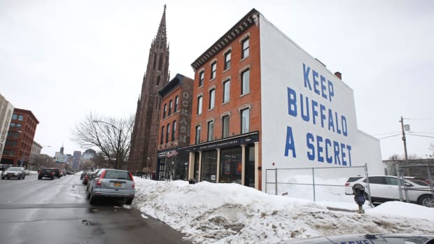 What started as a bumper sticker, \"Keep Buffalo A Secret\" is now a giant mural on the side of Oxford Pennant Manufacturing's building in the heart of downtown Buffalo, NY.

Sd 020822 Oxford X Metro