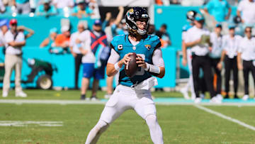 Sep 8, 2024; Miami Gardens, Florida, USA; Jacksonville Jaguars quarterback Trevor Lawrence (16) looks for a passing option against the Miami Dolphins during the fourth quarter at Hard Rock Stadium. Mandatory Credit: Sam Navarro-Imagn Images