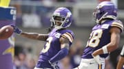 Sep 10, 2023; Minneapolis, Minnesota, USA; Minnesota Vikings wide receiver Jordan Addison (3) reacts with wide receiver Justin Jefferson (18) after scoring his first career touchdown pass from quarterback Kirk Cousins (not pictured) against the Tampa Bay Buccaneers during the second quarter at U.S. Bank Stadium. Mandatory Credit: Jeffrey Becker-USA TODAY Sports