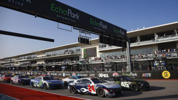 AUSTIN, TEXAS - MARCH 26: William Byron, driver of the #24 Liberty University Chevrolet, and Tyler Reddick, driver of the #45 Monster Energy Toyota, lead the field to an overtime restart during the NASCAR Cup Series EchoPark Automotive Grand Prix at Circuit of The Americas on March 26, 2023 in Austin, Texas. (Photo by Sean Gardner/Getty Images)