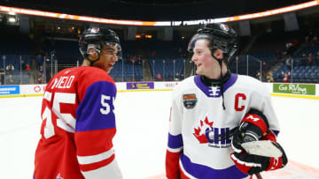 HAMILTON, ON - JANUARY 16: Alexis Lafreniere #11 of Team White and Quinton Byfield #55 of Team Red talk following the final whistle of the 2020 CHL/NHL Top Prospects Game at FirstOntario Centre on January 16, 2020 in Hamilton, Canada. (Photo by Vaughn Ridley/Getty Images)