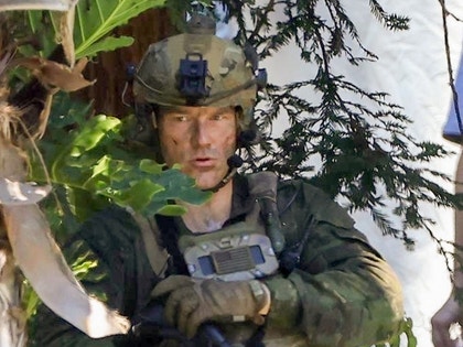 Chris Pratt Filming Way Of The Warrior In Camo Holding a Gun 4