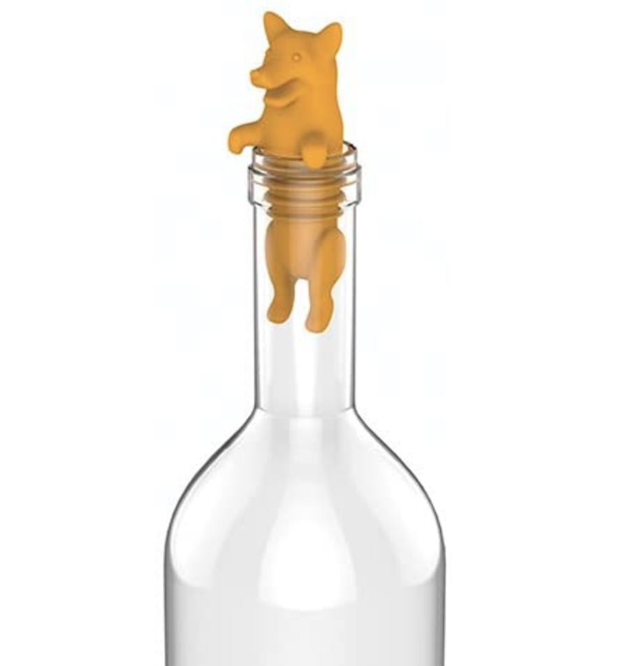 A silicone corgi-shaped wine stopper in a clear bottle to show its little butt hanging out in the bottle&#x27;s neck and its little paws chilling on top of the bottle&#x27;s lip 