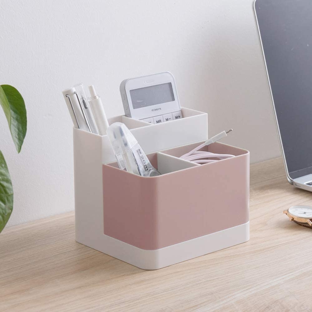 The pink and white organizer which has four compartments