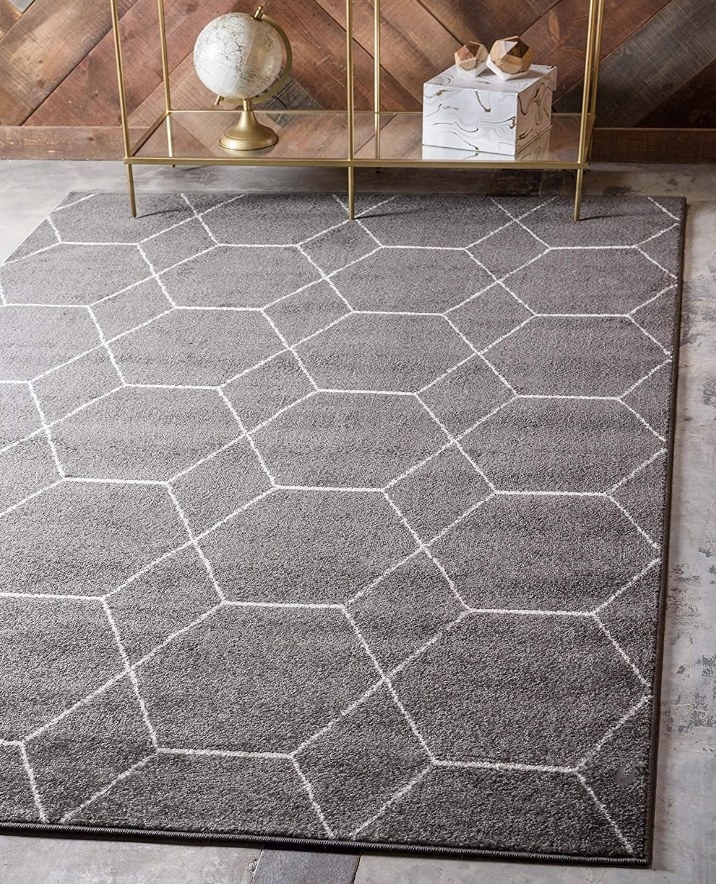 Gray area rug with white geometric design