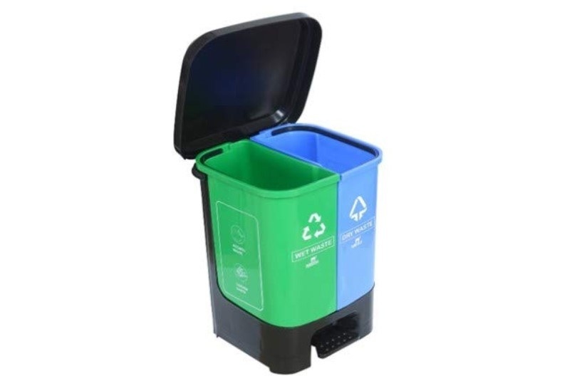 A black, green, and blue dustbin with separate compartments for wet and dry waste.