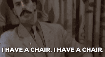 Gif of Sacha Baron Cohen in &quot;Borat&quot; saying &quot;I have a chair. I have a chair.&quot;