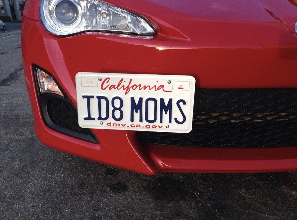 Car with license plate reading &quot;ID8 MOMS&quot;