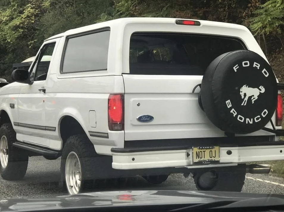 Car with license plate reading &quot;NOT OJ&quot;