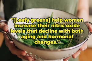 a woman holding a colander with spinach in it